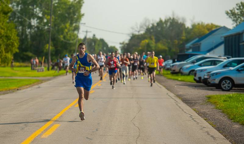 Brandon Rebert took a quick, long lead in the 2022 GLOW Arc Friends and Family 5K in Elba. Photo by Howard Owens.