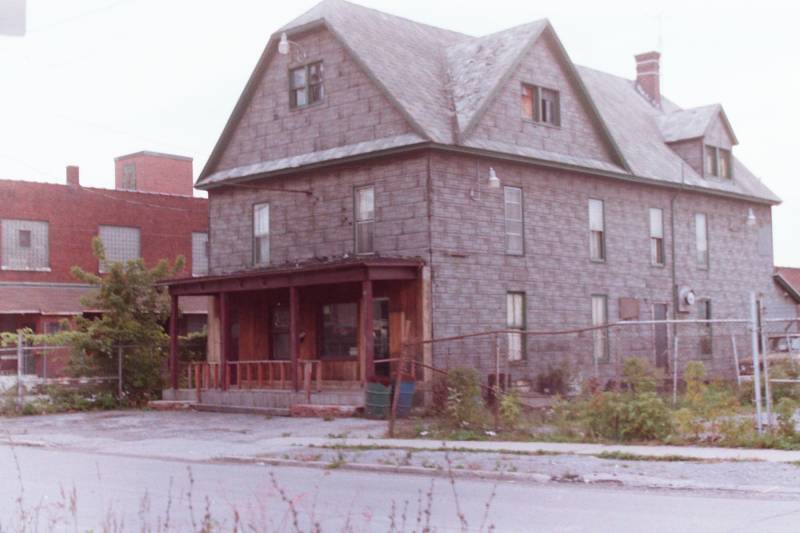Photo of 46 Swan St., Batavia, taken by Chuck Barnard in 1985, after it was Angel's but before it became Backhoe Joe's.  Bernard said it was originally Kornowski's Hotel, and the second floor was the first home of the Polish Falcons.
