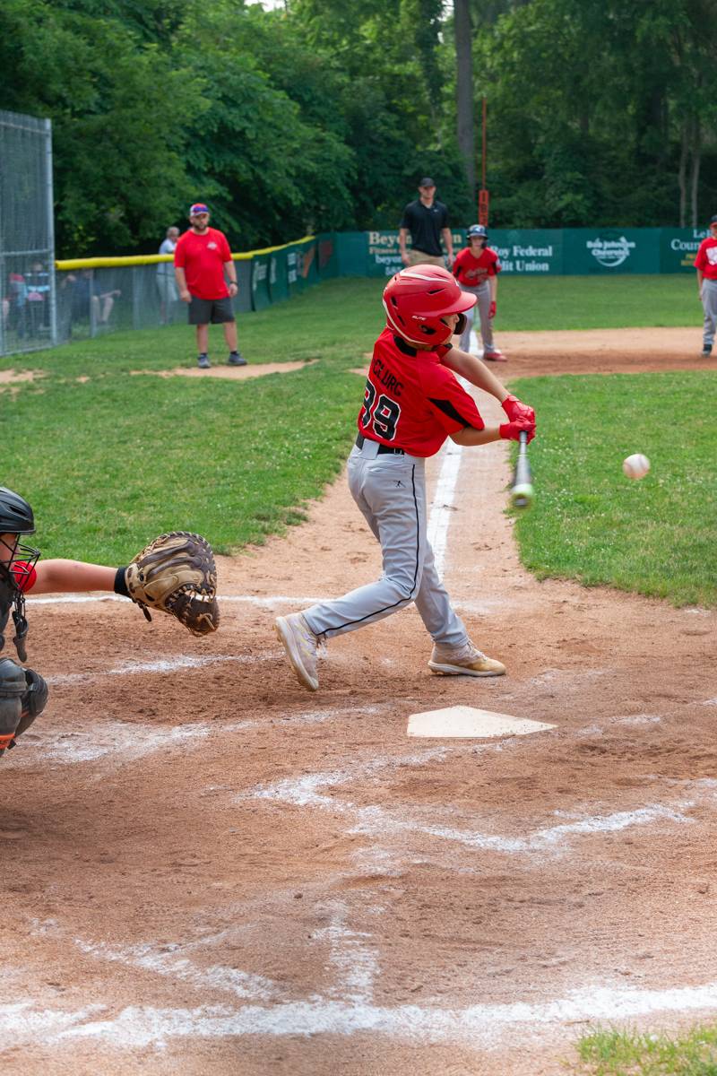 Another hit by LeRoy, late in the mercied game to get on base.  Photo by Steve Ognibene