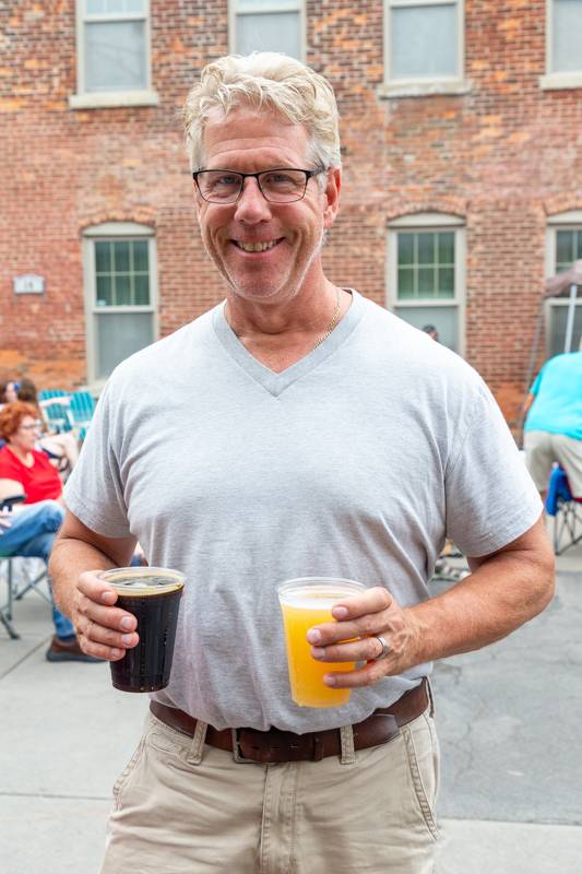 Man with drinks at Ramble