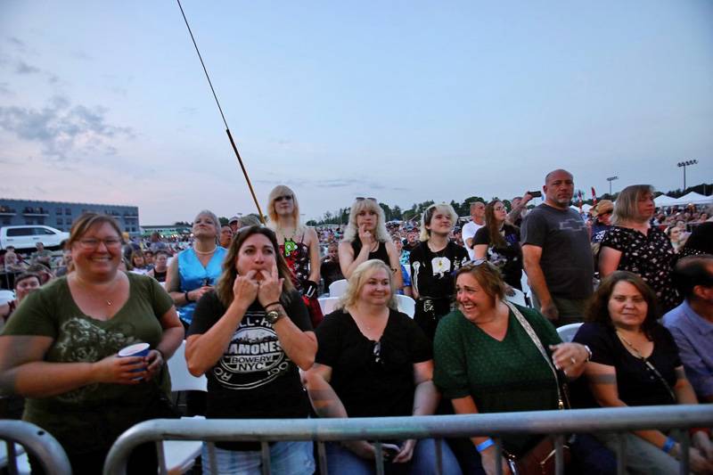 Buffalo Sabres fan Keith Marshall walks to an outdoor concert