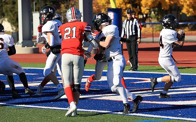 Drew Strollo (far right) puts Knights on the scoreboard with this one-yard rush at end of the first quarter.