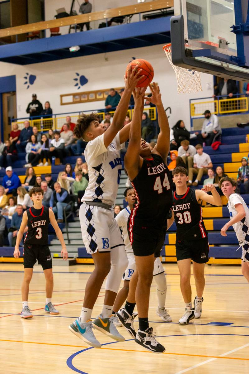 Batavia's Justin Smith and LeRoy's Jean Agosto scrapping for the ball .   Photo by Steve Ognibene