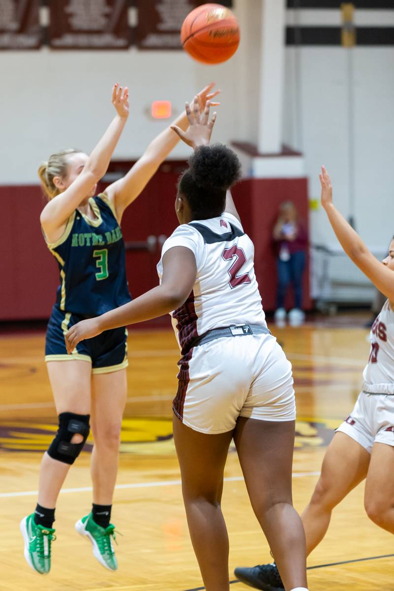 Clarissa Milliman shooting from three point range.  Photo by Steve Ognibene