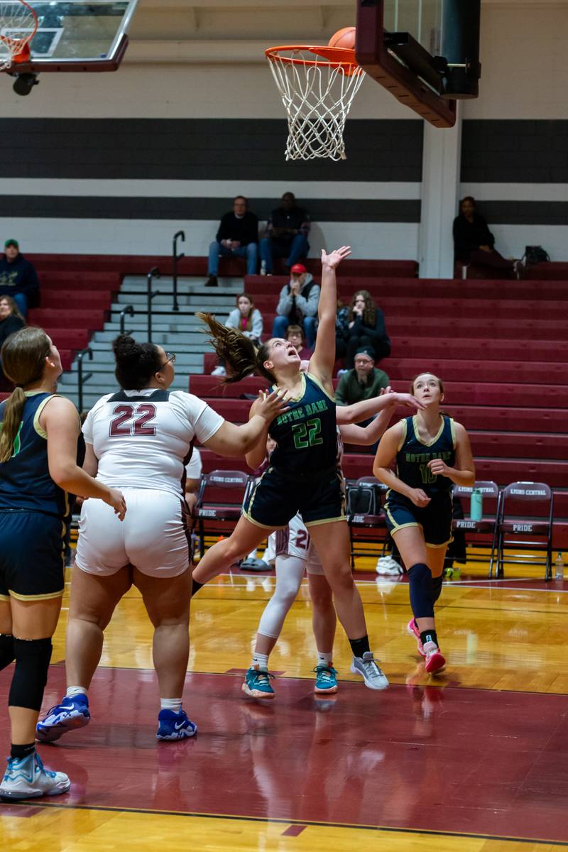 Senior Nina Bartz going to the hoop.  Bartz tallied 8 points.  Photo by Steve Ognibene