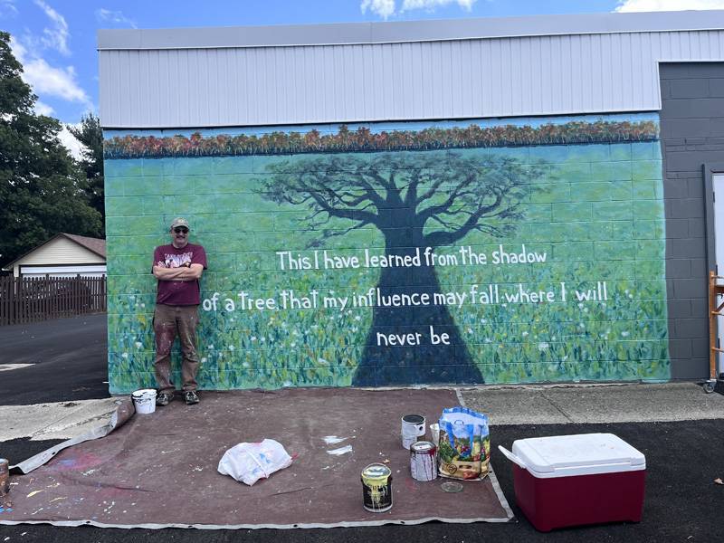 David Burke with tree mural at The Goose