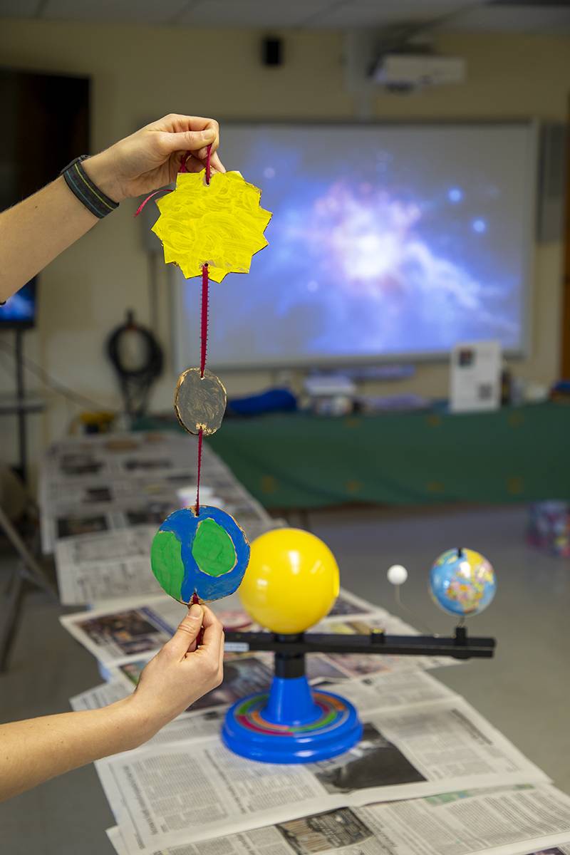 A mobile eclipse solar system made out of paper, cardboard materials is one of different things to make on eclipse day.  Photo by Steve Ognibene