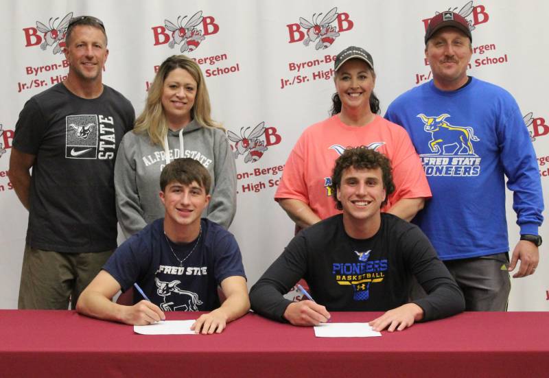 chambry-and-martin-with-their-families-at-signing_3.jpg