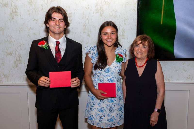 Annette La Barbera co-chair of scholarship awards presented them to the award recipients Julia Clark and Andrew David Strollo  Photo by Steve Ognibene