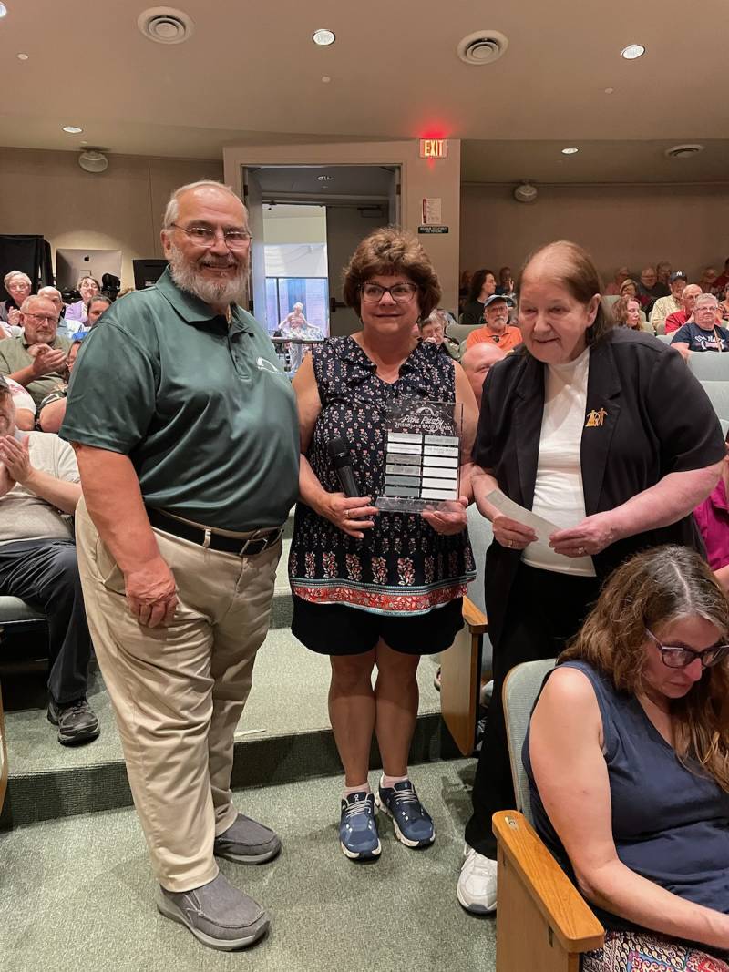 Dan Fisher, BCB Board President , Joanne Holota, BCB Board Member, Recipient of the Pam Frisby Friend of the Batavia Concert Band Award.  Patti Pacino representing the Pacino Family presenting the award.  Photo by Jason Smith   