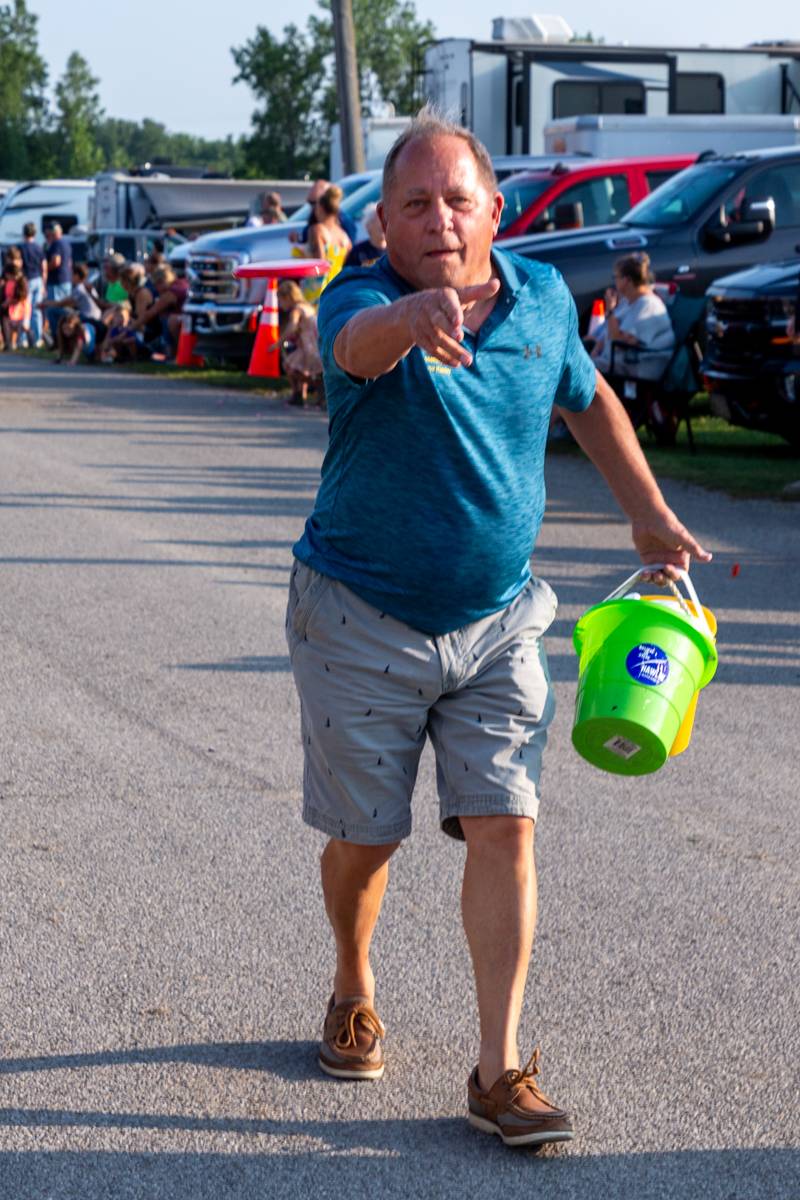 Assemblyman Steve Hawley tossing some candy to fair goers.  Photo by Steve Ognibene