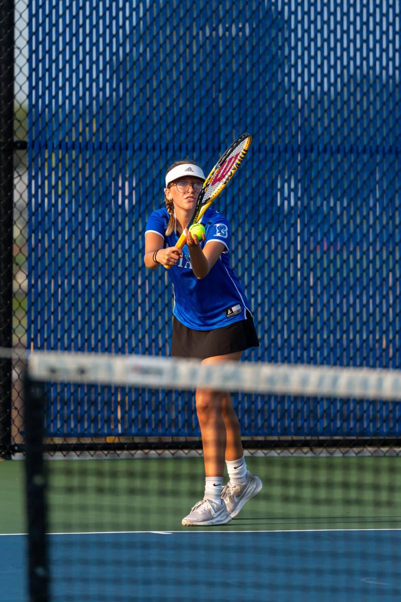 Batavia's Eliana Cossitt serving to Brockport's Alex Salcido in the tie-breaking set. Photo by Steve Ognibene