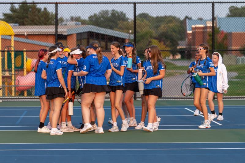 Batavia girls tennis team celebrate sophmore Eliana Cossitt's deciding match to bring them to victory in Brockport.  Photo by Steve Ognibene