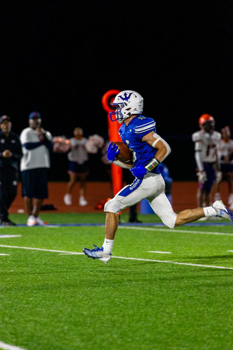 Greyson Fix runs over 70 yards for a touchdown.  Photo by Steve Ognibene