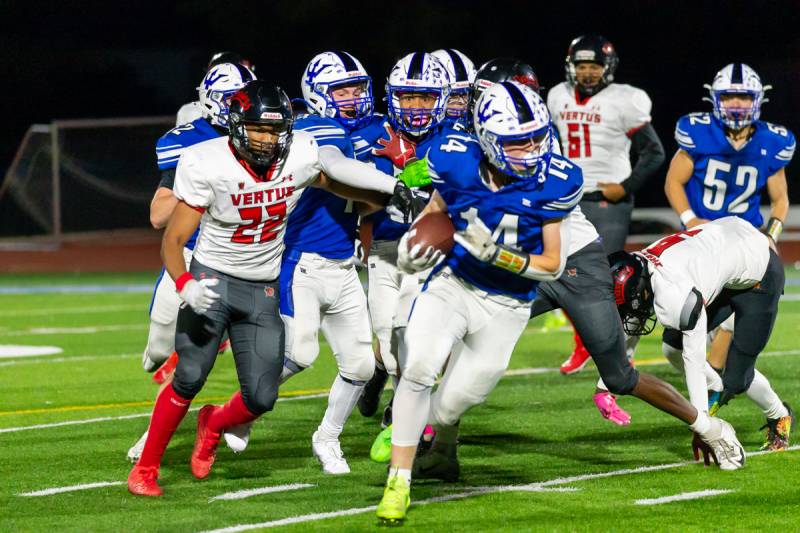 Batavia's Jameson Motyka strips the ball in the first half from Vertus and makes a big defensive play on senior night.  Photo by Steve Ognibene