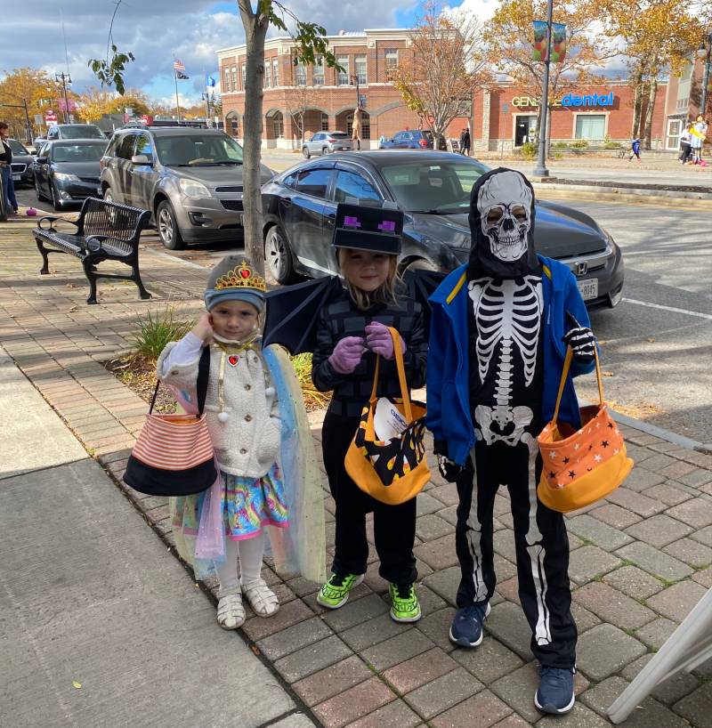 Princess and trick or treaters downtown