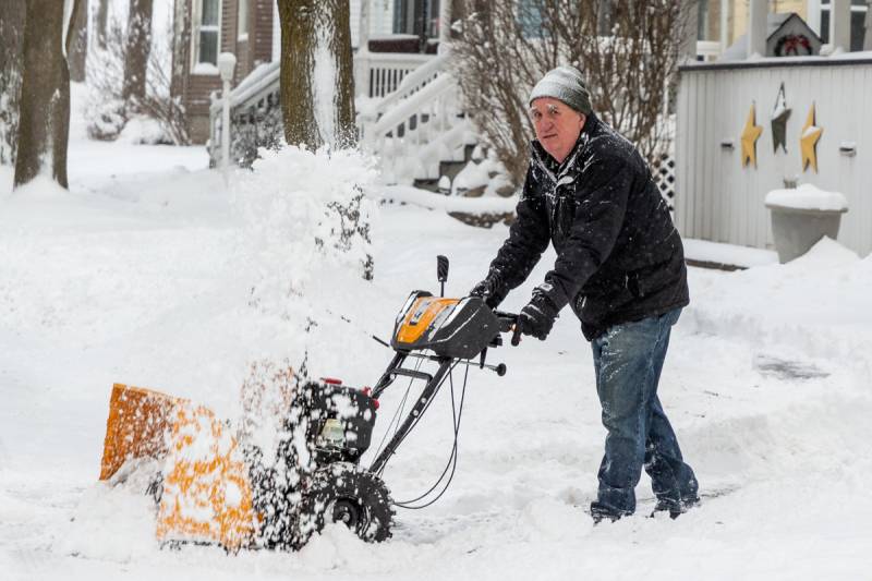 Many locals outside today for snow removal at residences.  Photo by Steve Ognibene