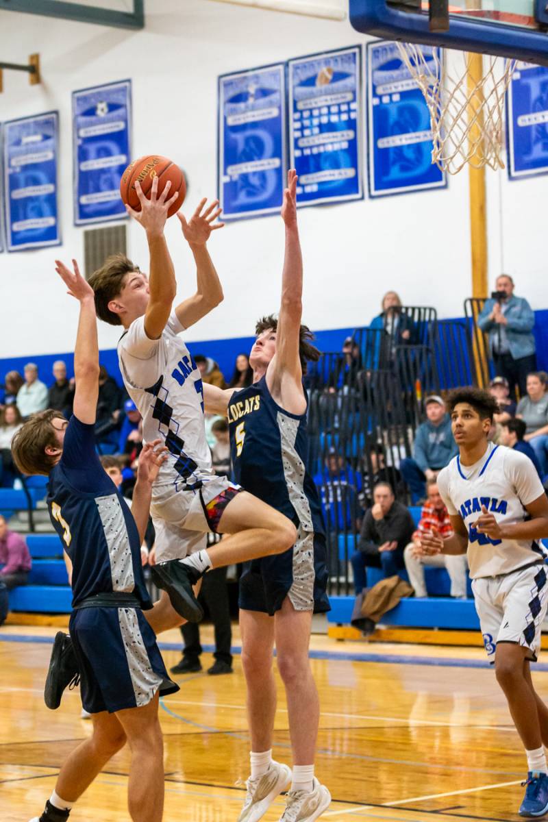 Carter Mullen going for two points last evening on Batavia's home court vs Marcus Whitman.  Photo by Steve Ognibene