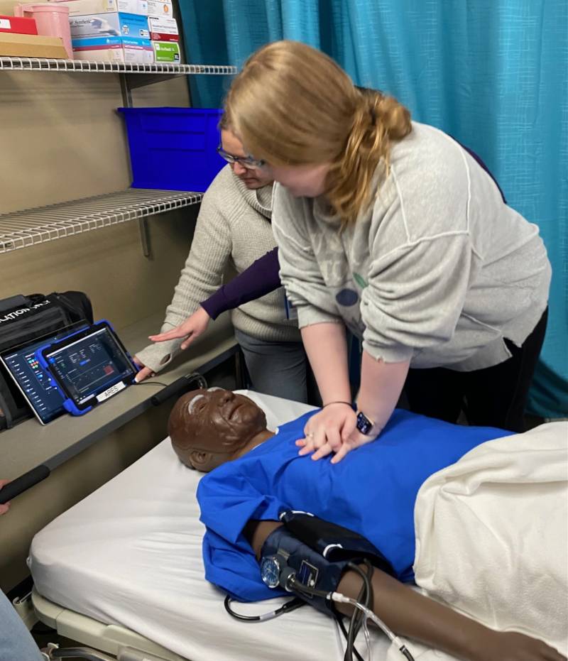 Madeline Wilson giving CPR