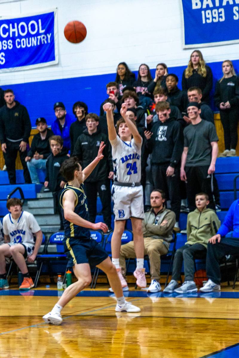 Ty Gioia sinks a 3-point bucket with 5.6 seconds left in regulation to give Batavia the victory 54-52 Friday evening at Batavia High School.  Photo by Steve Ognibene