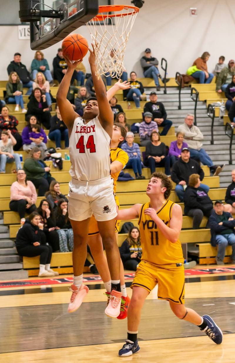  Jean Agusto drives to the hoop, scores 19 for the Knights in the win versus York.  Photo by Steve Ognibene